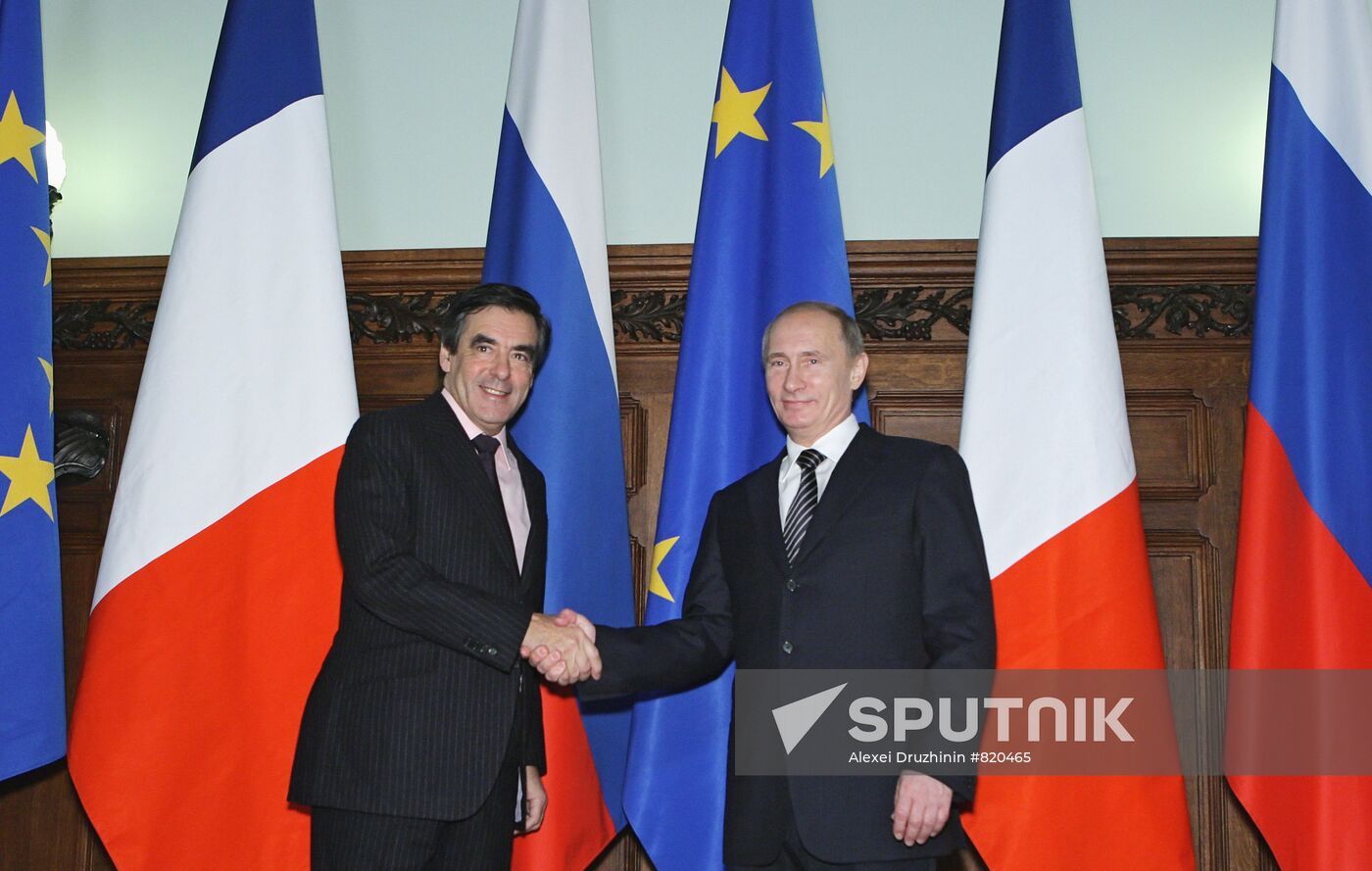 December 9, 2010. From right: Russian Prime Minister Vladimir Putin greeting French Prime Minister François Fillon in the Reception House of the Russian Government. Location: Russia, Moscow. Author: Alexei Druzhinin/Sputnik. Vladimir Putin meets with François Fillon in Moscow