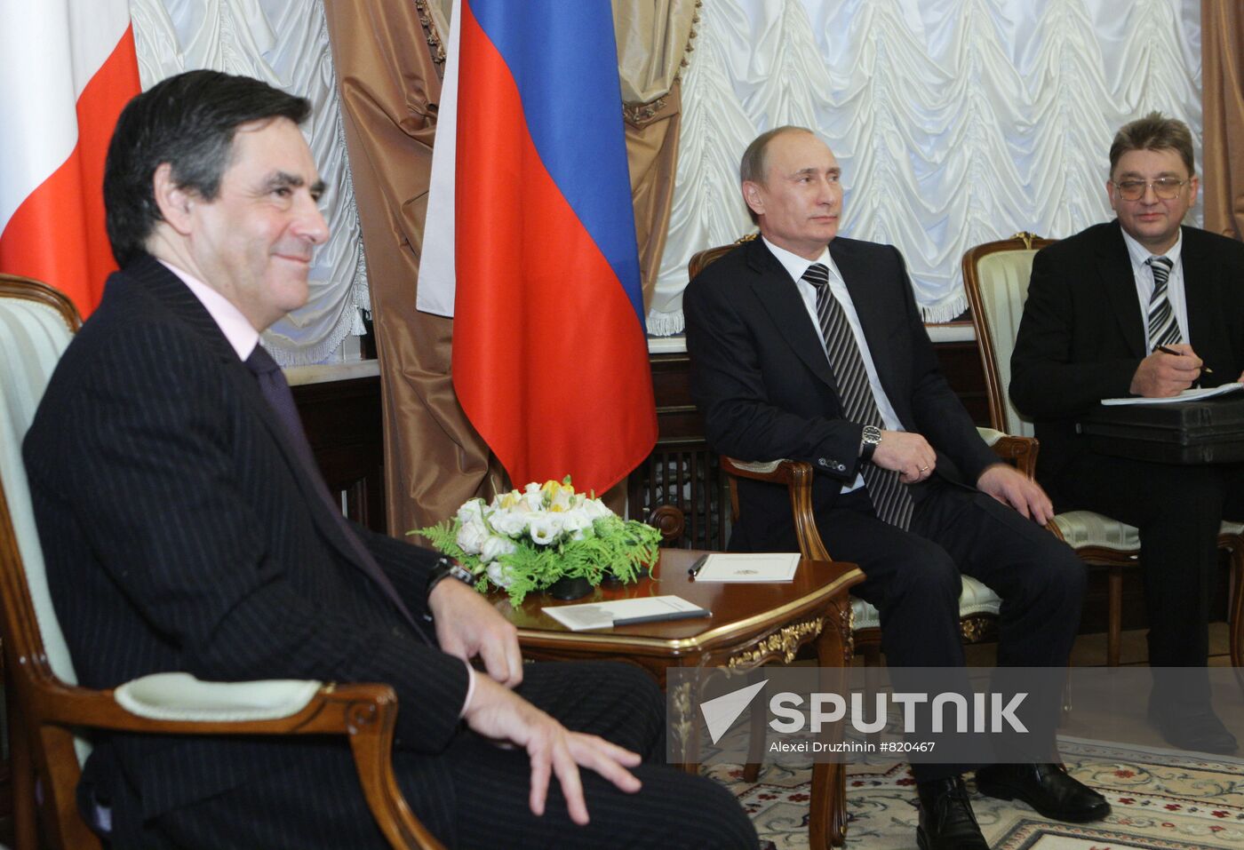 December 9, 2010. ussian Prime Minister Vladimir Putin, second right, and French Prime Minister François Fillon, left, talking in the Reception House of the Russian Government. Location: Russia, Moscow. Author: Alexei Druzhinin/Sputnik. Vladimir Putin meets with François Fillon in Moscow