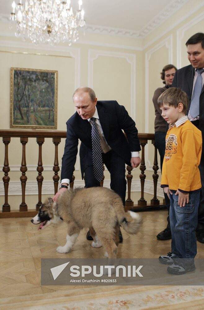 Putin meets boy who invented name for his new dog