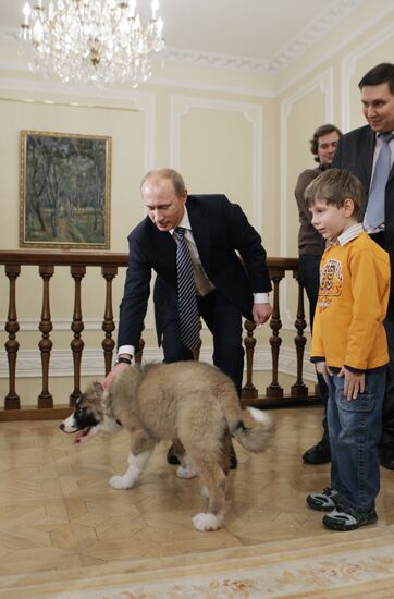 Putin meets boy who invented name for his new dog