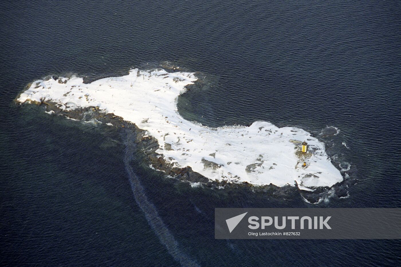 An island with a light-house in the Barents Sea