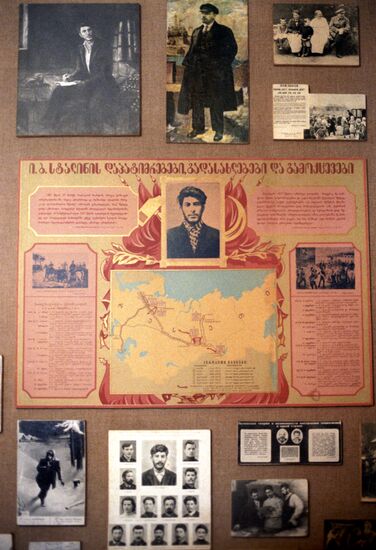 Stands with photos in "cult museum" of Stalin