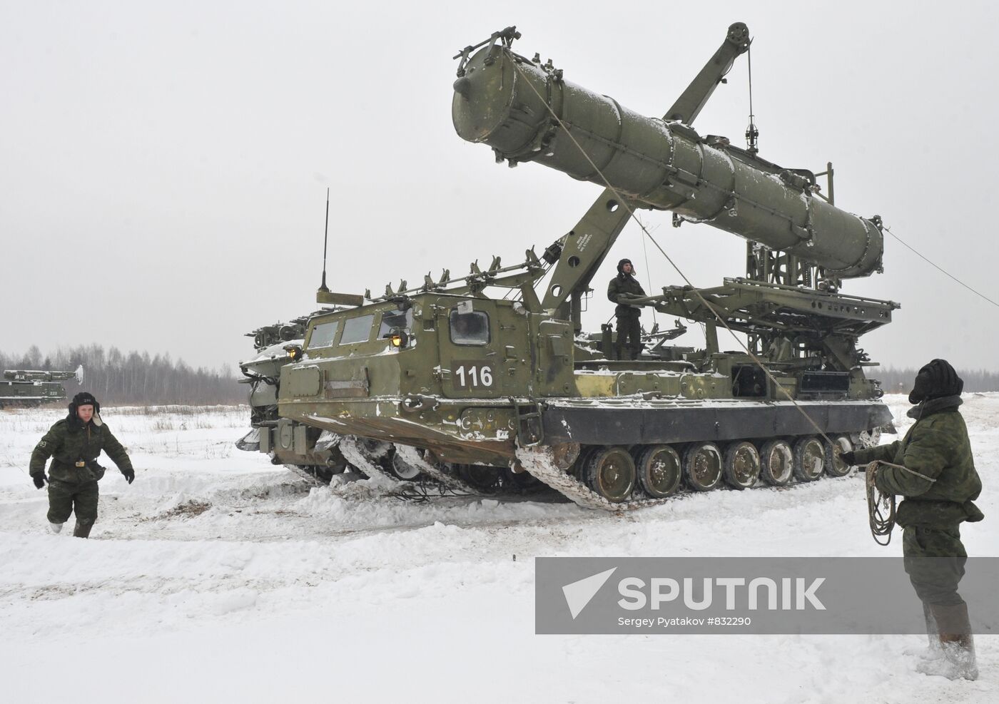 Staff reload a missile to launcher of air defense system C-300B