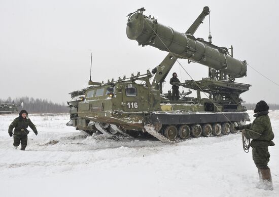 Staff reload a missile to launcher of air defense system C-300B