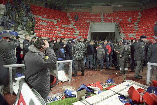 Fans clashing with police after match
