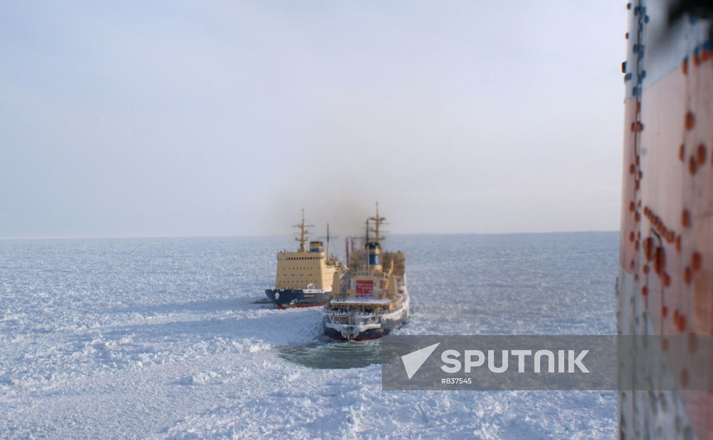 Icebreakers leading out ice-trapped ships in Sea of Okhotsk