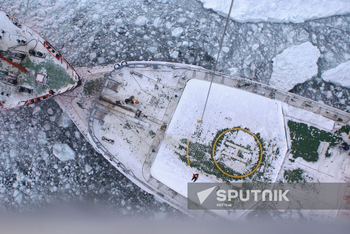 Icebreakers leading out ice-trapped ships in Sea of Okhotsk