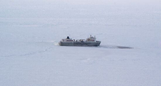 Icebreakers leading out ice-trapped ships in Sea of Okhotsk