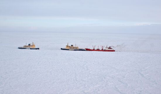 Icebreakers leading out ice-trapped ships in Sea of Okhotsk