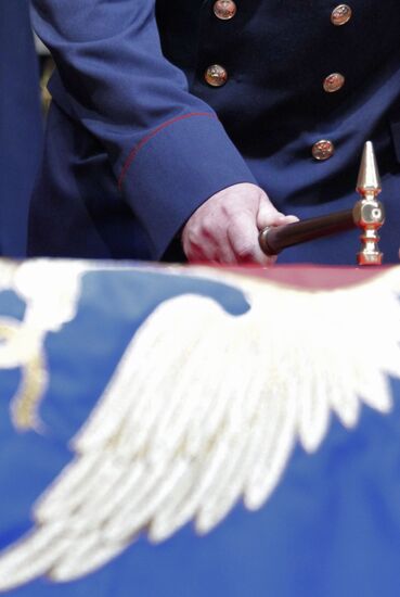 Ceremony of nailing down FPS flag to pole