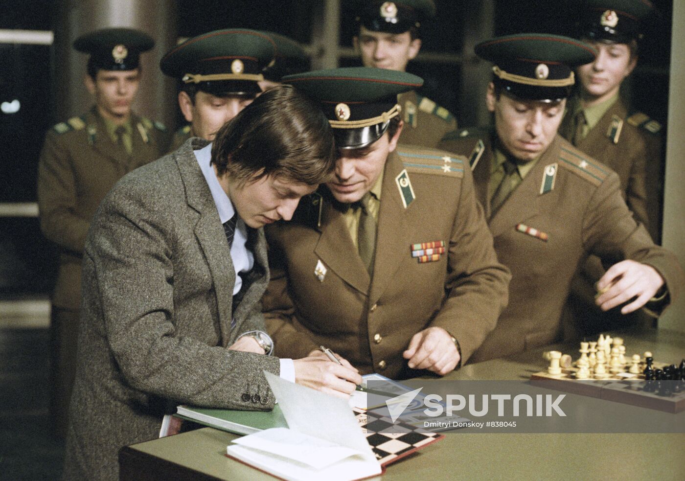 Anatoly Karpov giving autographs