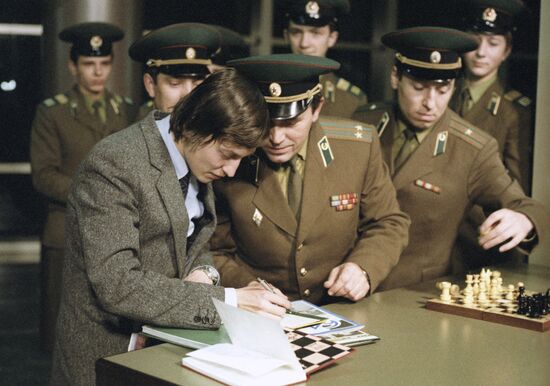 Anatoly Karpov giving autographs