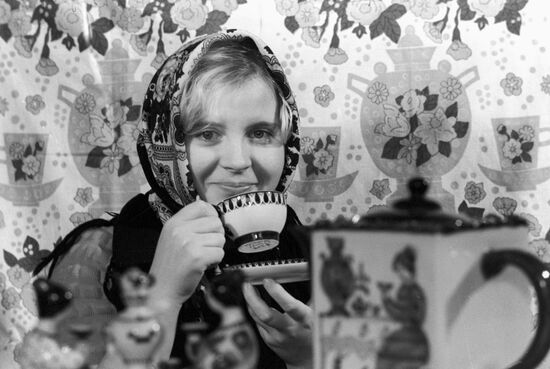 Girl with Gzhel tableware