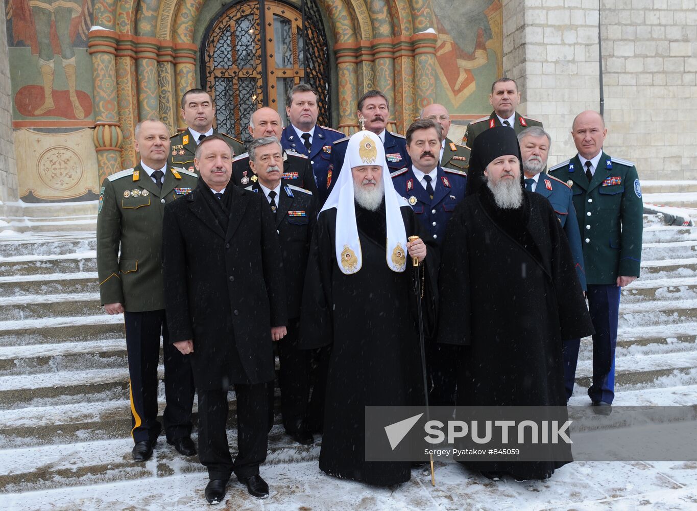 Patriarch Kirill posing with Cossacks' atamans