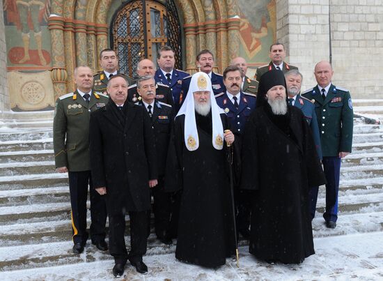 Patriarch Kirill posing with Cossacks' atamans