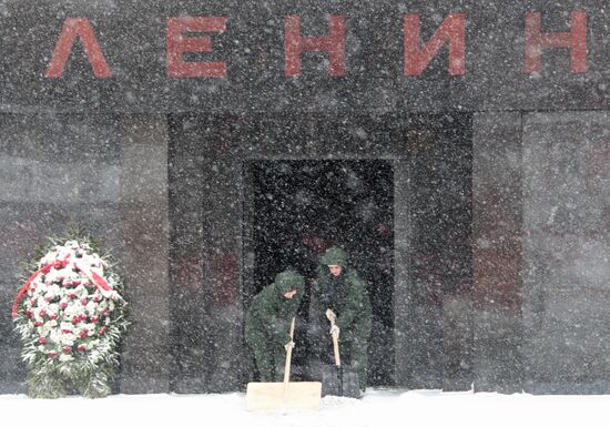 Cleaning snow at Lenin's Mausoleum at Red Square