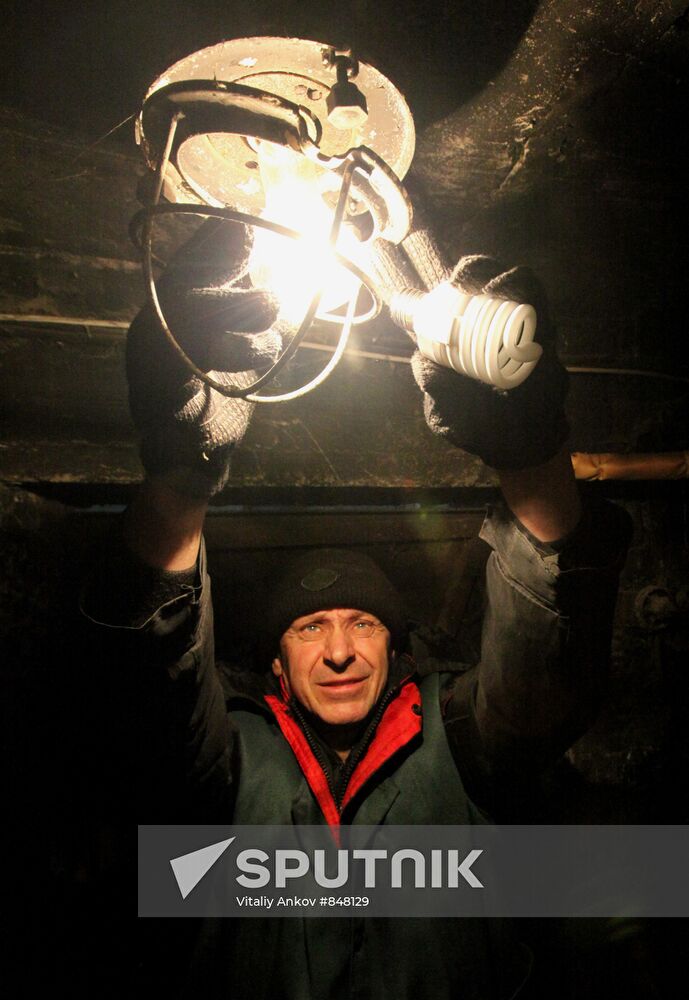 Installing energy-saving bulbs