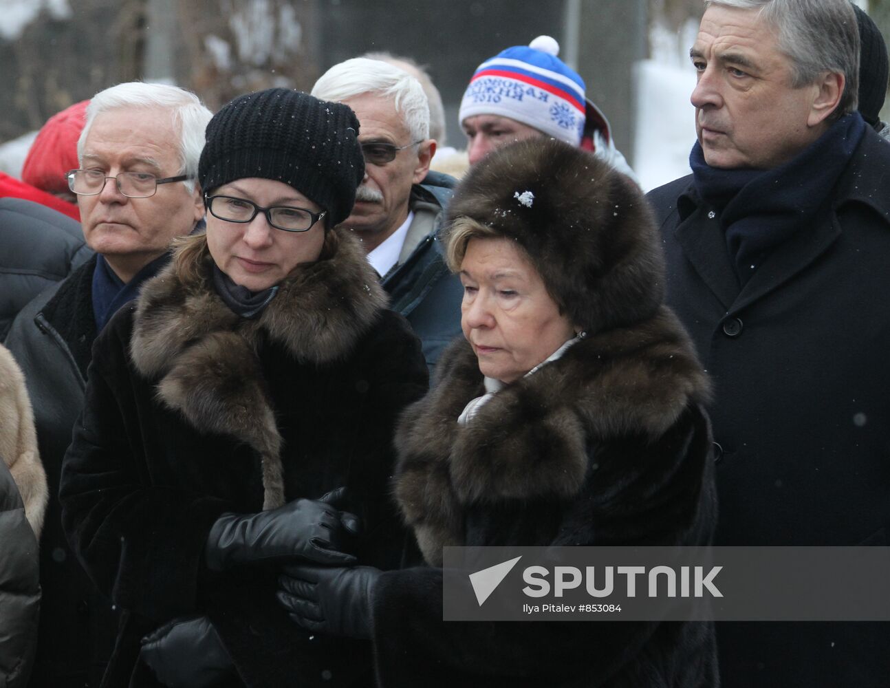 Laying flowers on first Russian President Boris yeltsin's grave