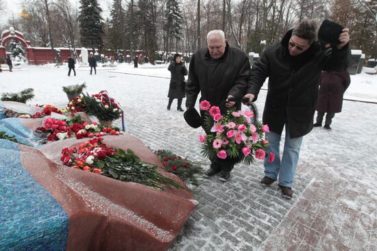 Laying flowers to first Russian President Boris Yeltsin's grave
