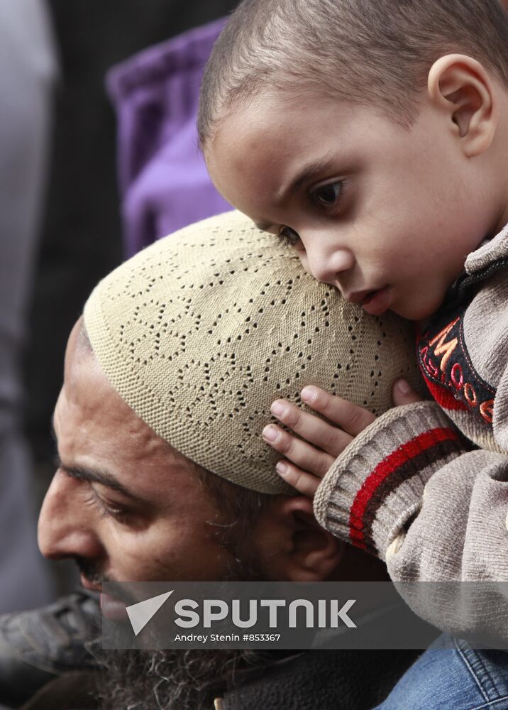 Cairo resident with his child