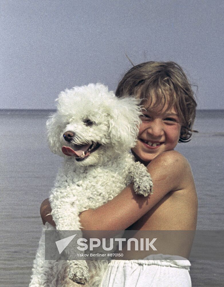 A child with a dog