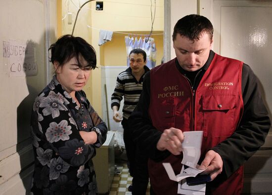 Federal Migration Service officers check up empty house