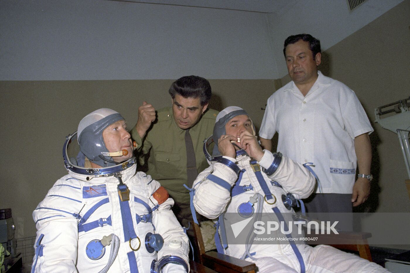 Georgy Beregovoi and Pavel Popovich instructing Alexei Leonov and Valery Kubasov immediately before training flight during ASTP program