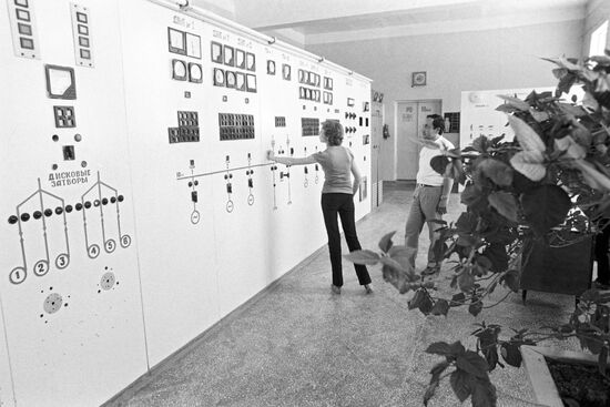 Operator at pumping station control panel