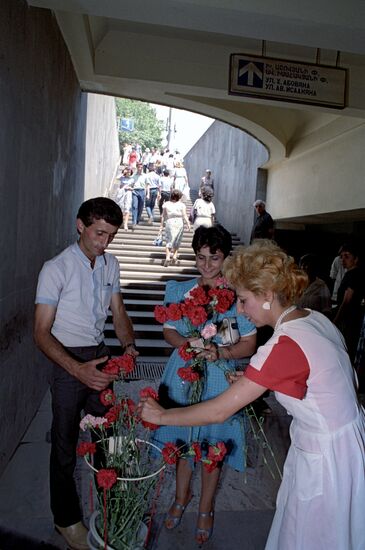 Selling flowers in underpass