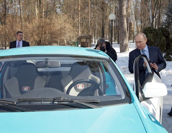 Prime Minister Vladimir Putin drives new Yo-Mobile car