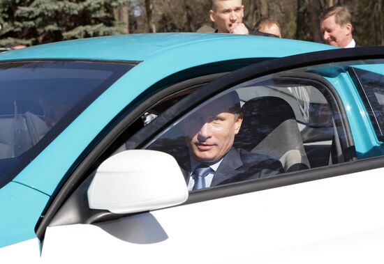 Prime Minister Vladimir Putin drives new Yo-Mobile car