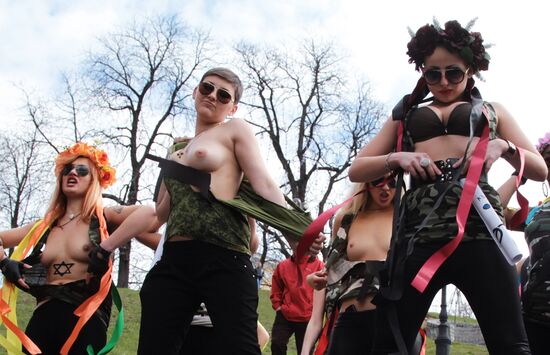 FEMEN women's movement activists hold a protest "Fashizofreniya"