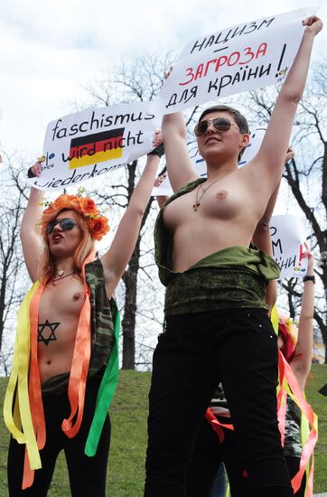 FEMEN women's movement activists hold a protest "Fashizofreniya"