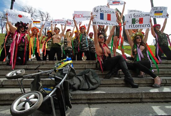 FEMEN women's movement activists hold a protest "Fashizofreniya"