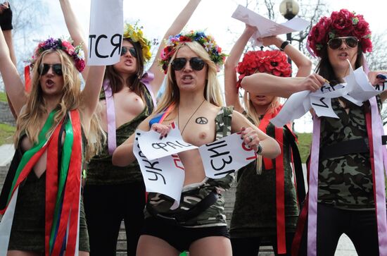 FEMEN women's movement activists hold a protest "Fashizofreniya"