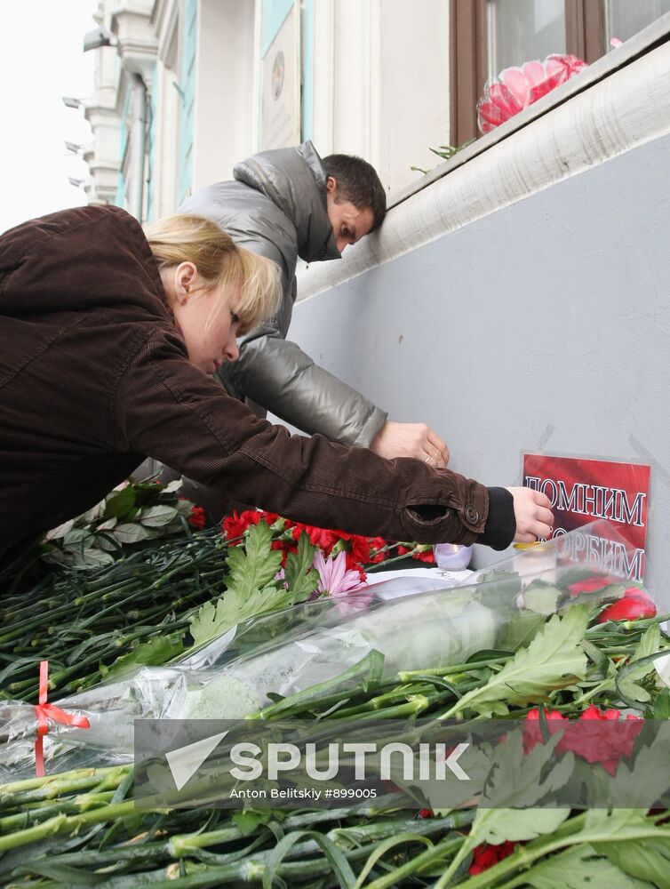 People lay flowers in memory of Minsk Metro blast victims