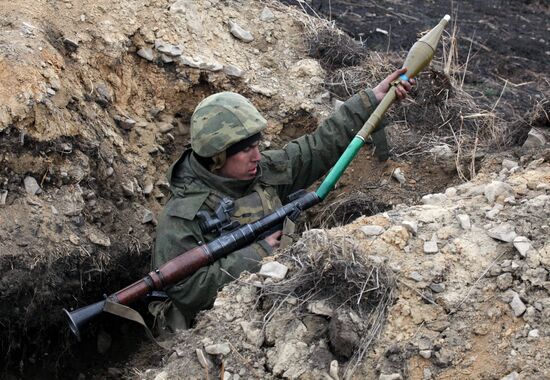 Mariner prepares grenade launcher for shelling
