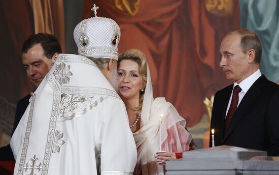 Dmitry Medvedev and Vladimir Putin attend Easter service