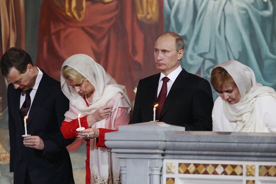Dmitry Medvedev and Vladimir Putin attend Easter service
