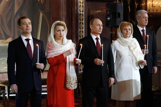 Dmitry Medvedev and Vladimir Putin attend Easter service