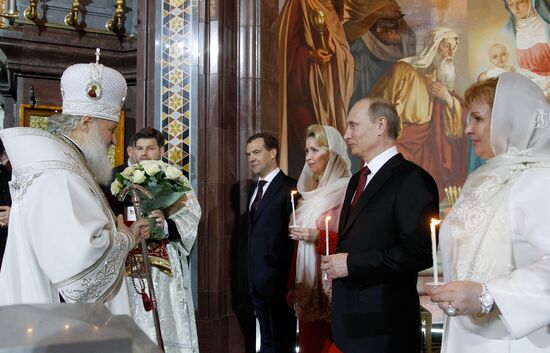 Dmitry Medvedev and Vladimir Putin attend Easter service