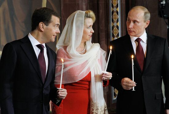 Dmitry Medvedev and Vladimir Putin attend Easter service