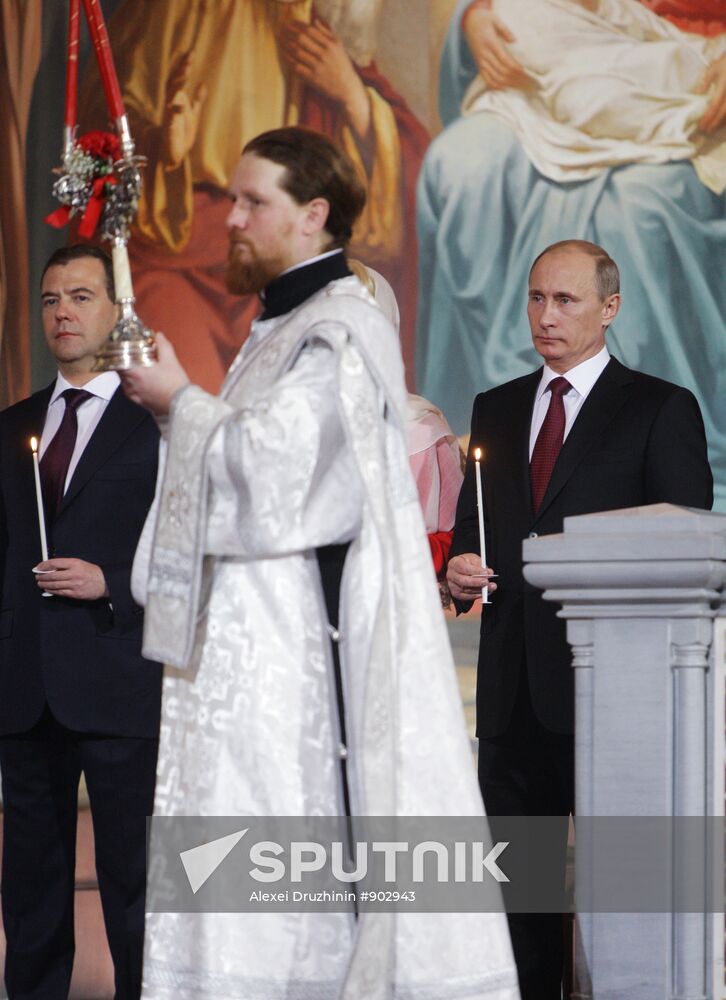 Dmitry Medvedev and Vladimir Putin attend Easter service