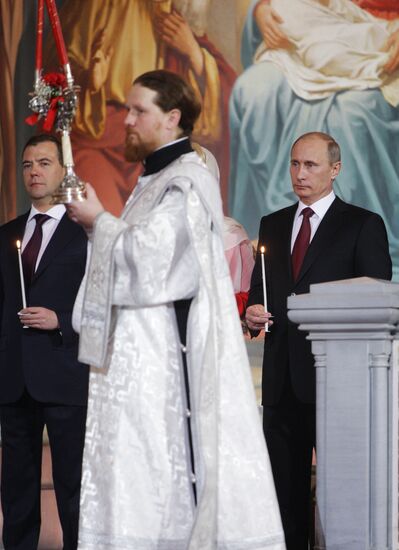 Dmitry Medvedev and Vladimir Putin attend Easter service