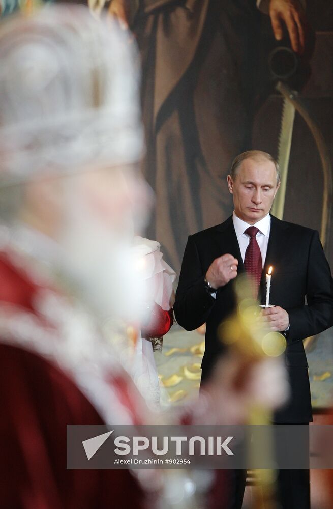 Dmitry Medvedev and Vladimir Putin attend Easter service