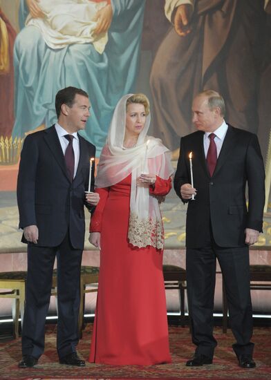 Dmitry Medvedev and Vladimir Putin attend Easter service