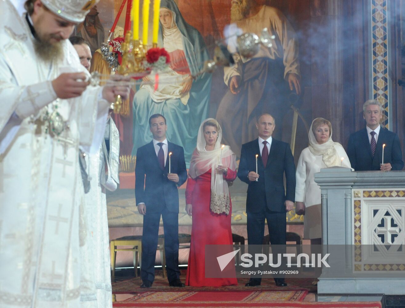 Dmitry Medvedev and Vladimir Putin attend Easter service