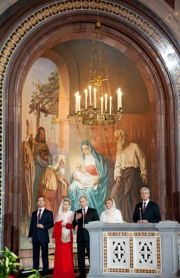 Dmitry Medvedev and Vladimir Putin attend Easter service