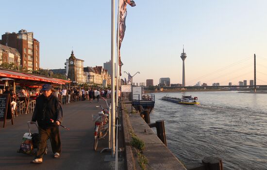 Citizens on an embankment in Dusseldorf