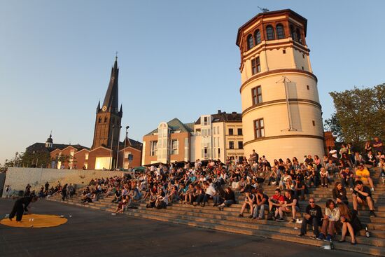 Citizens on an embankment in Dusseldorf